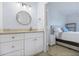 Well-lit bathroom with granite countertops, updated vanity, and access to the main bedroom at 1935 Gulf Of Mexico Dr # G7-304, Longboat Key, FL 34228