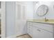 Well-appointed bathroom with granite countertops, white cabinets, and a convenient storage closet at 1935 Gulf Of Mexico Dr # G7-304, Longboat Key, FL 34228
