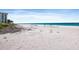 Expansive white sandy beach with turquoise ocean waters offers relaxation and scenic views at 1935 Gulf Of Mexico Dr # G7-304, Longboat Key, FL 34228