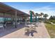 Charming outdoor patio featuring an open air dining area, perfect for enjoying ocean views at 1935 Gulf Of Mexico Dr # G7-304, Longboat Key, FL 34228