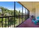 This screened patio offers lush landscaping views and comfortable outdoor seating at 1935 Gulf Of Mexico Dr # G7-304, Longboat Key, FL 34228