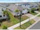 Aerial view of a well-maintained home featuring lush landscaping and a two-car garage in a Gathering-friendly neighborhood at 2477 Water Willow Dr, Lutz, FL 33558