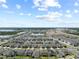 Panoramic aerial view of a Primary-planned community with lakes, lush landscaping, and modern homes at 2477 Water Willow Dr, Lutz, FL 33558