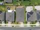 Aerial view of house with manicured landscaping and mature trees at 2477 Water Willow Dr, Lutz, FL 33558