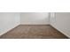 Bedroom with neutral carpet, white walls and trim, and window with view to the outdoors at 2477 Water Willow Dr, Lutz, FL 33558