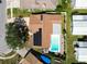 Aerial view of home featuring pool, solar panels, and nice landscaping at 254 Timberview Dr, Safety Harbor, FL 34695