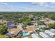 Aerial view of neighborhood featuring a pool and mature trees at 254 Timberview Dr, Safety Harbor, FL 34695