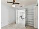 View of the bedroom featuring French doors, and a view into the living room at 254 Timberview Dr, Safety Harbor, FL 34695
