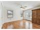 Bonus room offers wood-look floors, a ceiling fan, and large windows at 254 Timberview Dr, Safety Harbor, FL 34695