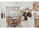 Eat-in kitchen with glass top dining table and stainless steel appliances at 254 Timberview Dr, Safety Harbor, FL 34695