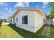Exterior view of home with stucco siding and manicured lawn at 254 Timberview Dr, Safety Harbor, FL 34695