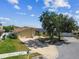 Beautiful one-story home with solar panels, brick driveway and well-manicured lawn at 254 Timberview Dr, Safety Harbor, FL 34695