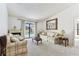 Living room features plush carpet, fireplace, and sliding glass doors to pool at 254 Timberview Dr, Safety Harbor, FL 34695