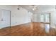Open-concept living room with hardwood floors, ceiling fan, and natural light at 254 Timberview Dr, Safety Harbor, FL 34695