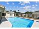 Home showcasing a pool and patio, surrounded by fencing and landscaping at 254 Timberview Dr, Safety Harbor, FL 34695