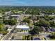 An aerial view of a modern townhome complex within a lush, green residential neighborhood at 3402 E 28Th Ave # 6, Tampa, FL 33605