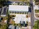 Aerial view of a modern townhome complex with private garden spaces and dedicated parking at 3402 E 28Th Ave # 6, Tampa, FL 33605