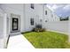 A townhome backyard with white privacy fence and a black framed glass door at 3402 E 28Th Ave # 6, Tampa, FL 33605