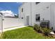 Townhome backyard with a privacy fence and grass at 3402 E 28Th Ave # 6, Tampa, FL 33605