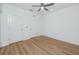 Bedroom showcases a ceiling fan and light-colored floors, accented by neutral-toned walls and doors at 3402 E 28Th Ave # 6, Tampa, FL 33605