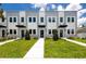 Attractive townhomes featuring a landscaped lawn and matching trees and shrubbery at 3402 E 28Th Ave # 6, Tampa, FL 33605