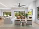 Airy living room with fireplace, contemporary furnishings, and expansive windows that bring the outside in at 3408 W Arch St, Tampa, FL 33607