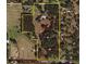 Aerial view of property highlighting land, home, and topographic details at 34211 Blanton Rd, Dade City, FL 33523