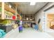 Spacious basement area with concrete walls and open shelving for storage of supplies and goods at 34211 Blanton Rd, Dade City, FL 33523