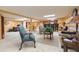 Open concept basement area featuring a seating area, bar, and dining space at 34211 Blanton Rd, Dade City, FL 33523