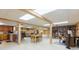Spacious basement featuring a kitchen, dining area, and built-in bookshelves at 34211 Blanton Rd, Dade City, FL 33523