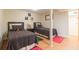 Cozy bedroom featuring wood floors, and two twin beds with grey patterned bedding at 34211 Blanton Rd, Dade City, FL 33523