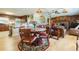 Open-concept dining area with hardwood floors, stylish lighting, and easy access to the kitchen and living room at 34211 Blanton Rd, Dade City, FL 33523