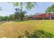 Sprawling brick ranch-style home with large yard and mature trees creates a peaceful and private setting at 34211 Blanton Rd, Dade City, FL 33523