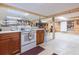 Open basement kitchen area with stove, cabinets, and access to other rooms at 34211 Blanton Rd, Dade City, FL 33523