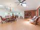 Spacious living room with high ceilings, skylights and adjacent dining area at 34211 Blanton Rd, Dade City, FL 33523