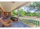 Charming outdoor space featuring potted plants, comfortable seating, and a scenic view of the expansive yard at 34211 Blanton Rd, Dade City, FL 33523