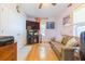 Relaxing sitting room with sofa, storage, and a television, under a ceiling fan at 34211 Blanton Rd, Dade City, FL 33523