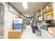 Unfinished storage area with shelving, offering ample space for organization and belongings at 34211 Blanton Rd, Dade City, FL 33523