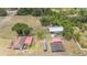 A high angle view of the property displaying the house, outbuildings, and surrounding land at 3515 Bell Farms Dr, Plant City, FL 33566