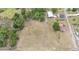 Aerial view showcasing a large lot, a home and multiple outbuildings including garages at 3515 Bell Farms Dr, Plant City, FL 33566