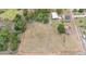 Expansive property featuring a residence, outbuildings, wooded areas, and large open field, ideal for various uses at 3515 Bell Farms Dr, Plant City, FL 33566