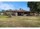 Spacious backyard with a covered patio perfect for outdoor entertaining and relaxation at 3515 Bell Farms Dr, Plant City, FL 33566