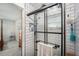 Modern bathroom featuring a tiled shower with a glass enclosure, sleek fixtures, and a convenient layout at 3515 Bell Farms Dr, Plant City, FL 33566