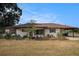 Charming single-story home featuring a well-kept yard and a convenient carport at 3515 Bell Farms Dr, Plant City, FL 33566