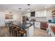 Well-equipped kitchen boasting a central island, barstool seating, ample counter space, and modern appliances at 3515 Bell Farms Dr, Plant City, FL 33566