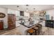 Stunning kitchen with a large island with seating, unique refrigerator, updated appliances, and stylish accents at 3515 Bell Farms Dr, Plant City, FL 33566