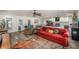 Spacious living area opens to the kitchen, featuring wood floors and natural light at 3515 Bell Farms Dr, Plant City, FL 33566