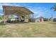 Spacious covered RV storage area with additional sheds for equipment and supplies at 3515 Bell Farms Dr, Plant City, FL 33566