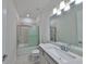 Bathroom featuring tiled shower-tub, modern vanity, and updated fixtures at 36959 Highland Meadows Ct, Zephyrhills, FL 33542