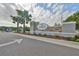 Community entrance sign 'The Oaks' with landscaped entry and gate at 36959 Highland Meadows Ct, Zephyrhills, FL 33542